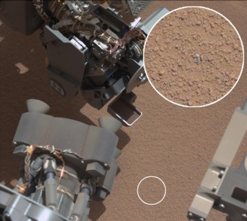 View of Curiosity's First Scoop Also Shows Bright Object This image from the right Mast Camera