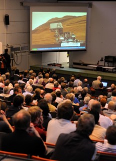 Scientists, students and family members follow the broadcasting of the Mars landing of the Curiosits robot, at the University in Kiel, Germany, 06 August 2012. The Curiosity robot is equipped with a n...