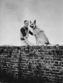 Prince George, Duke of Kent, 1902-1942  sitting on wall with dog circa 1935