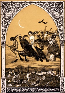 Naked witches riding goats and broomsticks to the Sabbath above a French town. Lithograph 1926.