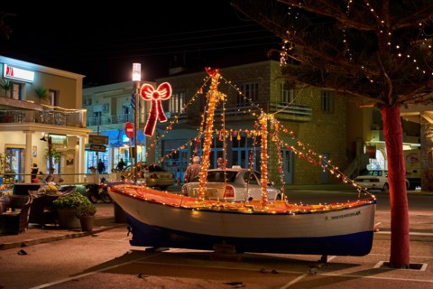 Wooden Christmas ship decorated at night. In the Greek tradition (especially in the islands) it is common to ornament a ship instead of a tree for Chr
