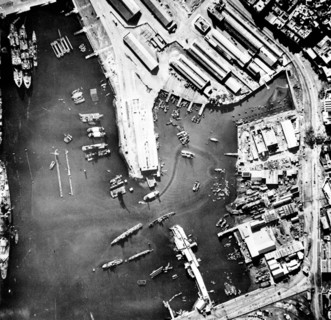 Aerial view of the port of Casablanca, Morocco, at the time of the Allied landings in North Africa. Note the sunken ship in the center of the harbour and the French battleship Jean Bart on the left. N...