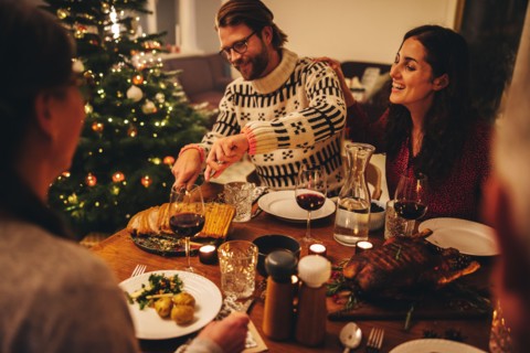 European family having christmas dinner together. Family celebrating christmas together at home.