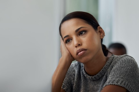 Life has been so boring lately. Shot of a young businesswoman looking bored at her desk.
