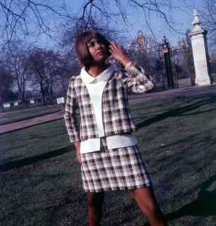Lady in business suit in the park 1960s
