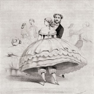 19th century lady wearing a crinoline at a ball.