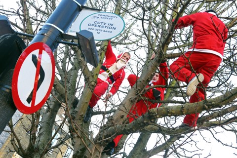 London, UK. 6th December 2014. Participants dressed as Father Christmas in the 2014 London Santacon in the streets of Camden, London which celebrates its 20th anniversdary this year Credit:  Paul Brow...