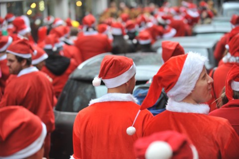 Hoxton, London, UK. 12th December 2015. Santacon London 2015, hundreds of Santas pub crawl