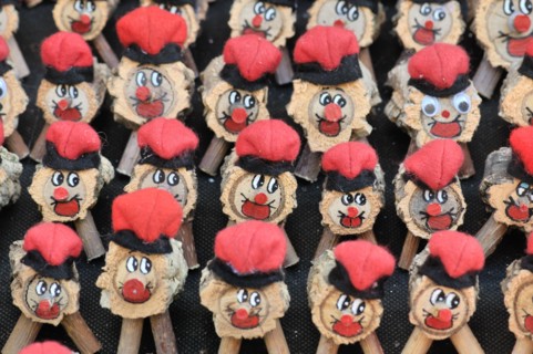 Tions de Nadal (Christmas logs), Catalan tradition, for sale at fair. Fira de Santa Llúcia, Barcelona, Catalonia, Spain