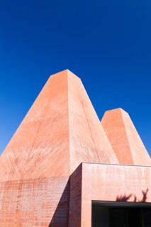 Paula Rego Museum, Cascais, Portugal. Exterior view of the red concrete pyramid-like chimneys.