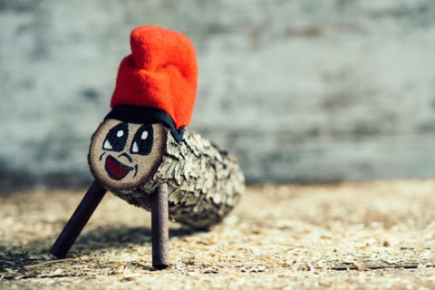 a handmade tio de nadal, a typical christmas character of catalonia, spain, with some blank space on the right