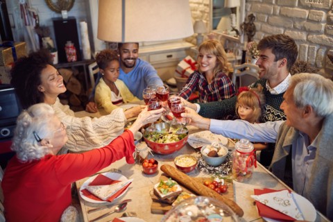 large happy family clinking glasses on Christmas dinner