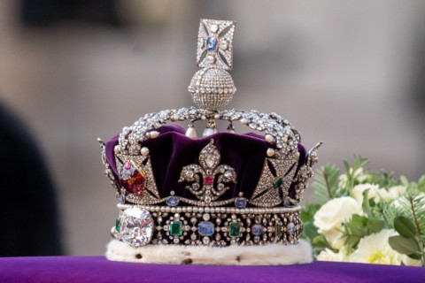 Queen Elizabeth II's coffin is taken in procession on a Gun Carriage of The King's Troop Royal Horse Artillery. The Coffin is draped with the Royal Standard with the Imperial State Crown on top follow...