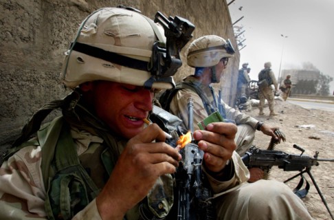 Iraq War April 2003 Baghdad American marines take postions in Eastern Baghdad as they liberate the city Our Picture Shows GI takes a smoke as he enters the city
