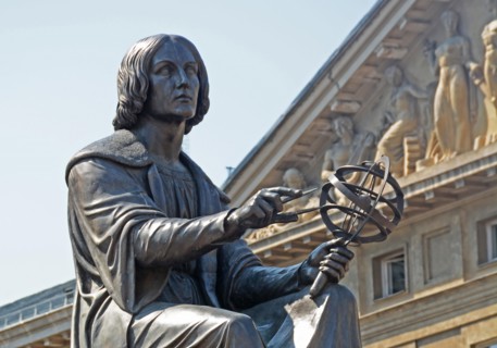the Polish astronomer Nicolaus Copernicus, holds a compass and armillary sphere,  Warsaw, Poland.