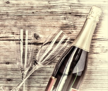 Champagne. Champagne bottle and two empty glasses on a wooden background. Valentine's Day. Birthday. Wedding. Anniversary. Rustic style.