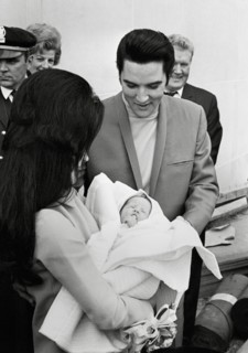 Elvis Presley, Priscilla Presley,  leaving the Baptist Hospital, Memphis, Tennessee, with their daughter Lisa-Marie, born at the hospital on February 1, 1968.  File Reference # 33635_680CPC