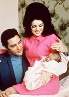 Elvis Presley, Priscilla Presley,  leaving the Baptist Hospital, Memphis, Tennessee, with their daughter Lisa-Marie, born at the hospital on February 1, 1968.   File Reference # 33635_703CPC