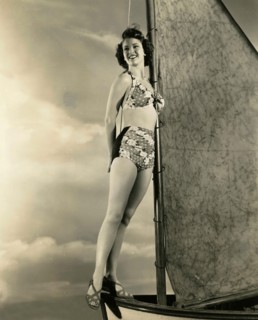 The American actress Frances Rafferty in a bathing suit on a small sailboat