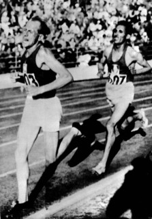 Finland 1952 Olympics, Emil Zatopek (CZE), from left, followed by Alain Mimoun (FRA), competes in 10 km race at Helsinki.