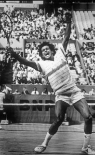 Yannick Noah celebrates after winning the 1983 French Open final at Roland Garros.
