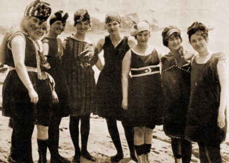 A circa 1910 photograph of a group of young ladies in Britain modelling fashionable swimwear of the time