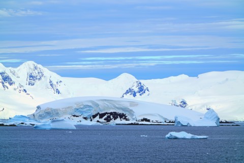Various types of iceberg landscapes. There are ice floes, glaciers, oceans, radioactive clouds, sunshine, this is the Antarctic summer.
