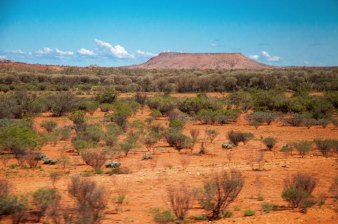 Desert landscape seen from The Ghan train south of Alice Springs, Northern Territory, Australia