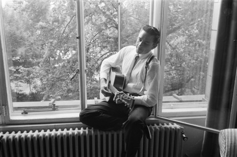 American country singer and musician Johnny Cash poses for photographers at the Savoy Hotel in London.17th September 1959.