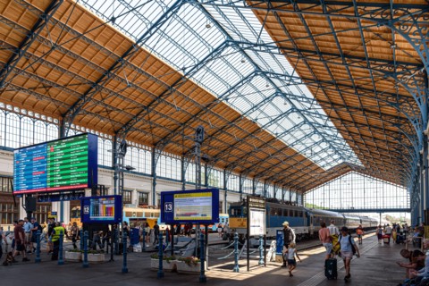 Commuters coming and going inside the Nyugati Railway Station in Budapest, Hungary