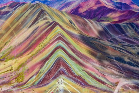 Aerial view of the Rainbow Mountains (Montana de Siete Colores) in Peru with Vinicunca in the center.