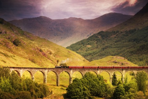 Jacobite steam train crossing Glenfinnan viaduct