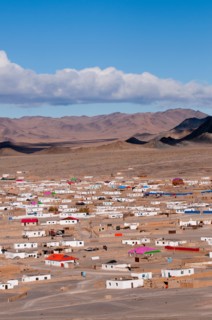 Outer suburbs of Olgii with some new houses among traditional homes.