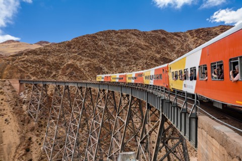 Train to the clouds (tren a las nubes) crossing La Polvorilla bridge in the Altiplano 4.200 meters/13800 feet high, Salta Province, Argentina