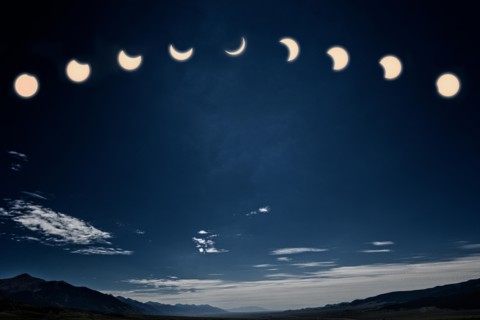 Photograph of the midday solar eclipse; the moon between earth & the sun