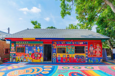 TAICHUNG, TAIWAN - JULY 19: Rainbow village is a popular travel destination where people can view colorful paintings and illustrations on the walls of