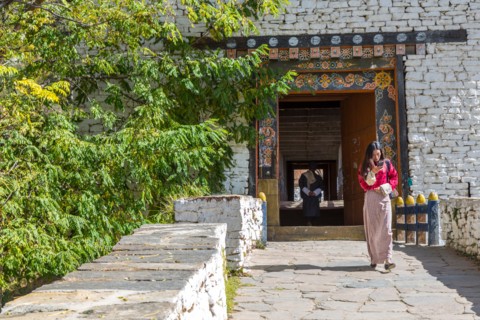 Paro, Bhutan.  Covered Bridge Leading to the Paro Dzong (Fortress).