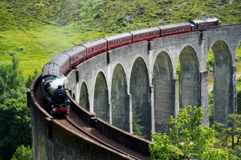 The Jacobite Express also known as the Hogwarts Express crosses the Glenfinnan Viaduct on route between Fort William and Mallaig.