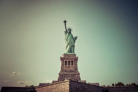 The statue of Liberty  with blue sky background.