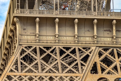 Close up of the detailed intricate Eiffel Tower wrought iron lattice work , The Eiffel Tower is the most visited paid monument in the world , Paris