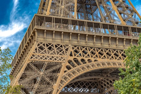 Close up of the detailed intricate Eiffel Tower wrought iron lattice work , The Eiffel Tower is the most visited paid monument in the world , Paris