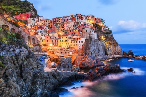 Manarola, Cinque Terre, Italy. Panoramic view of Manarola village at night.