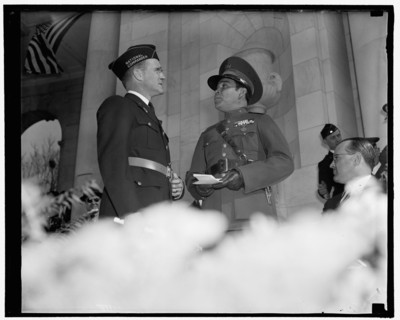 Greetings. Washington, D.C., Nov. 11. National Commander of the American Legion Stephen Chadwick, exchanges greetings with Cuba's Dictator Col. Fulgencio Batista at Armistice Day ceremonies at Arlingt...