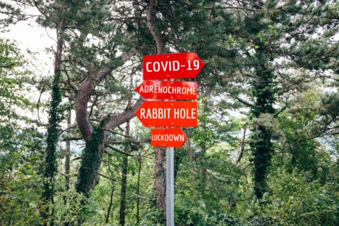 Covid-19, Adrenochrome, Rabbit Hole, Lockdown road warning red signs. Social media campaign for coronavirus plus fake news and total disorientation in