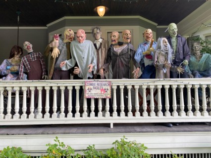 Scary Halloween installation on the porch of a large victorian house in the Flatbush neighborhood of Brooklyn New York.