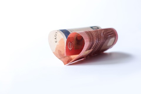 Love and money concept. Financial freedom theme - collect wealth by saving and investing small sums.