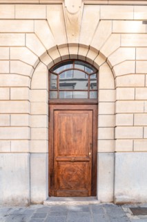 Paris, an old wooden door, typical building in the center