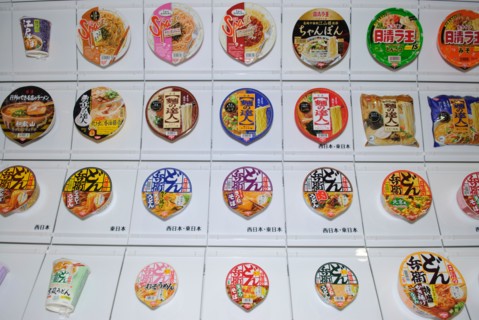 A wall showing some of Nissin's 200 instant ramen products, Instant Ramen Museum, Osaka, Japan, 1 December 2008.