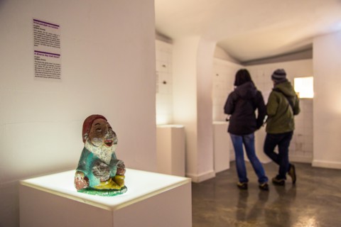 ZAGREB, CROATIA - 12 MARCH 2015: Tourists reading a love story in the Museum of Broken Relationships.