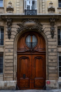 Ornate Paris Door - Thousands of doors and gates adorn buildings in Paris.  Some of the best are on government offices, cathedrals and churches, as we